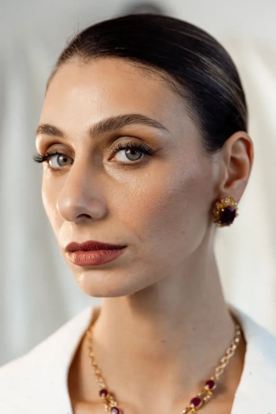 Portrait through a veil, gold chain necklace