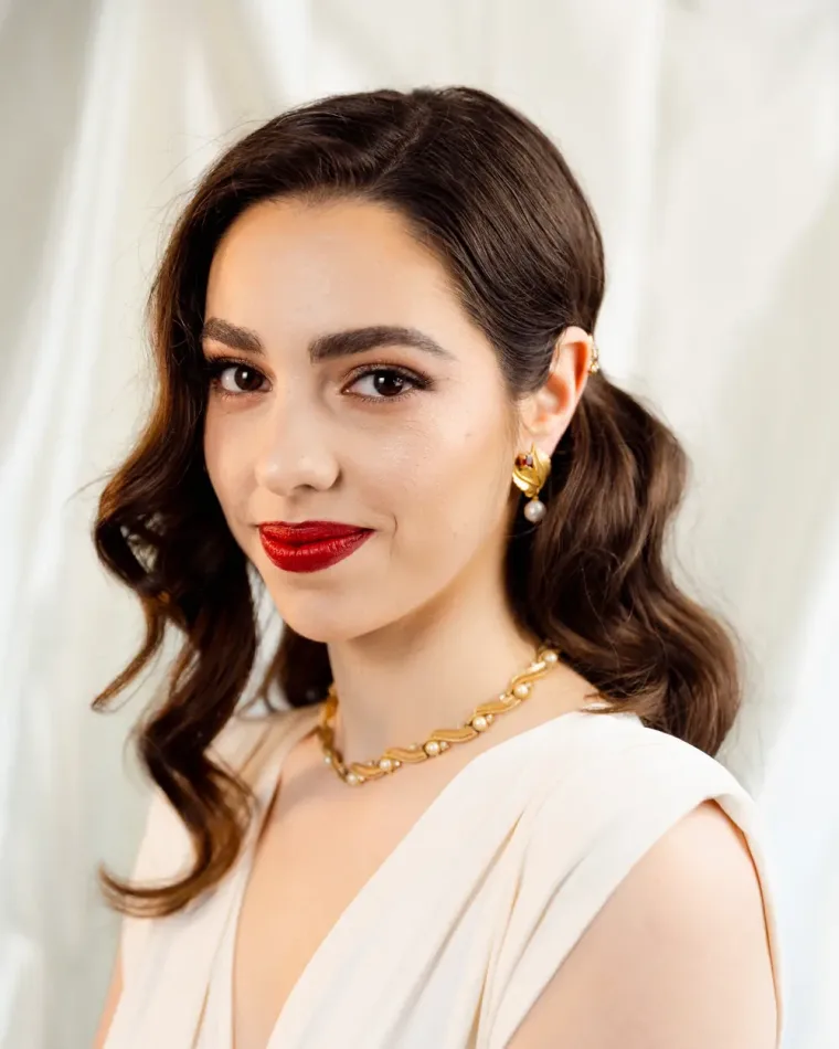 Full glam make-up with a red lip and soft waves