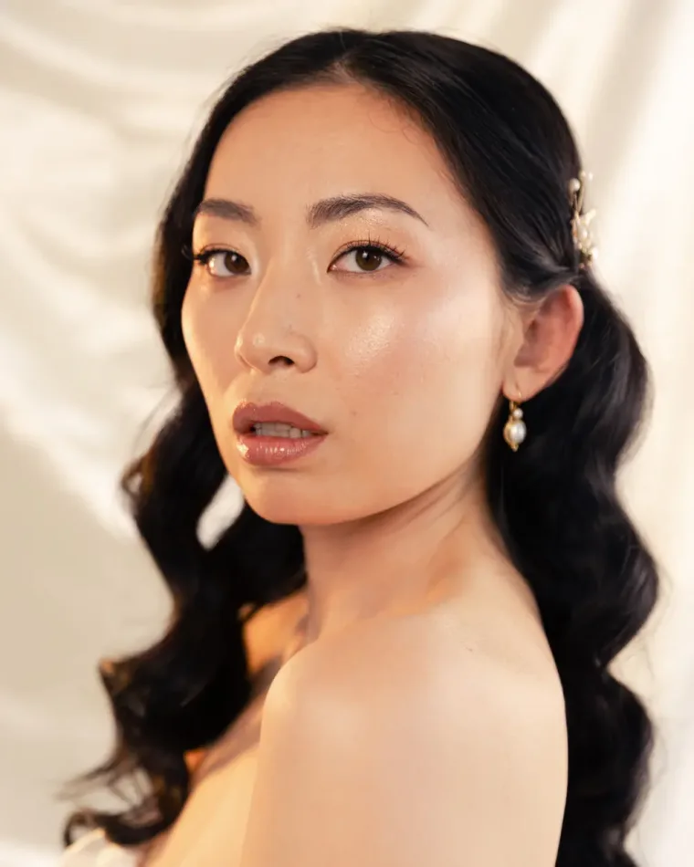 Long dark hair styled in soft waves