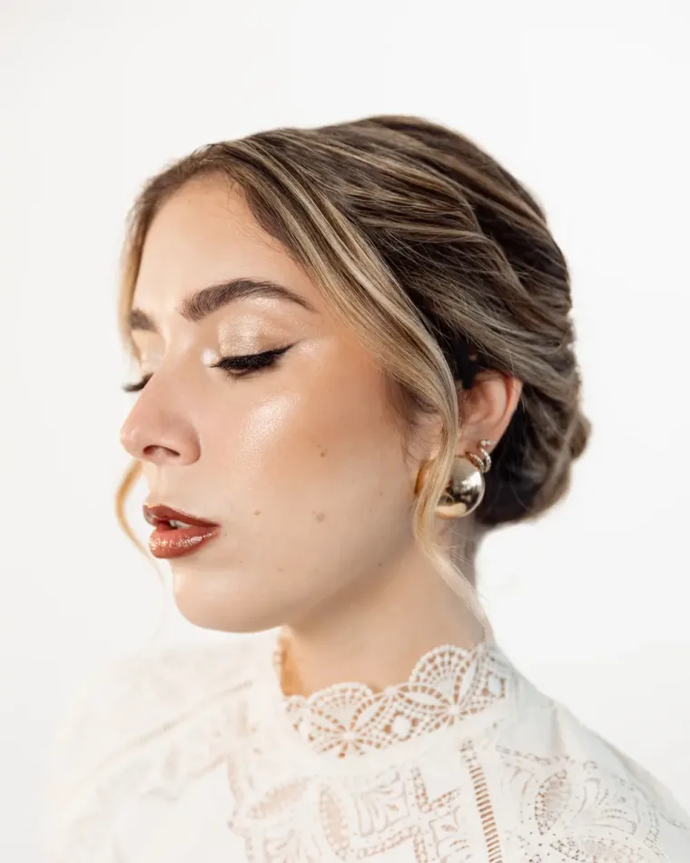Sleek low bun, seen in profile